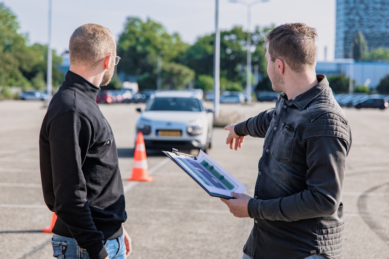 A driving instructor going through manoeuvres with a learner